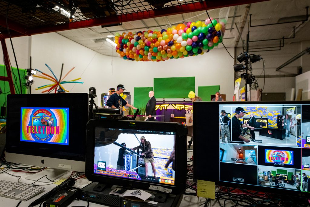 a view of several screens and monitors editing 